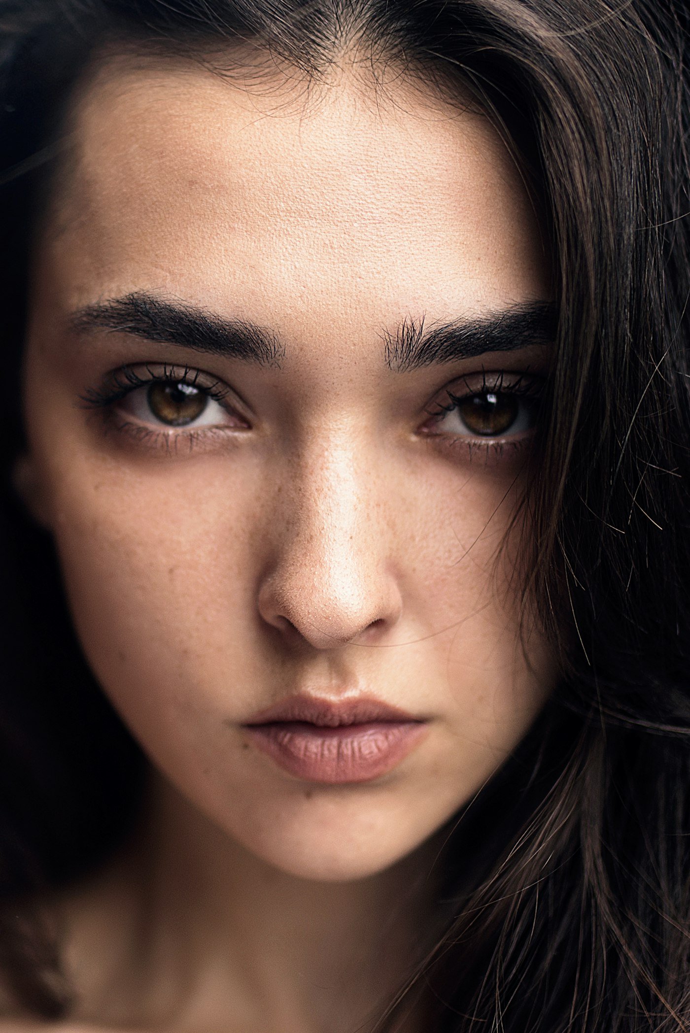 Womans face with black hair