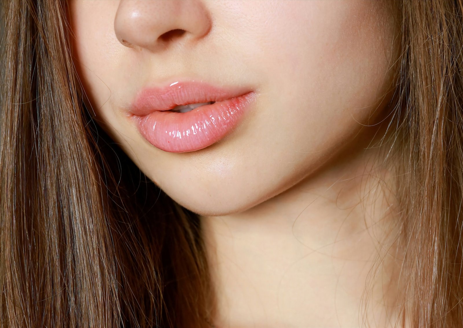 A close up of a woman with long brown hair