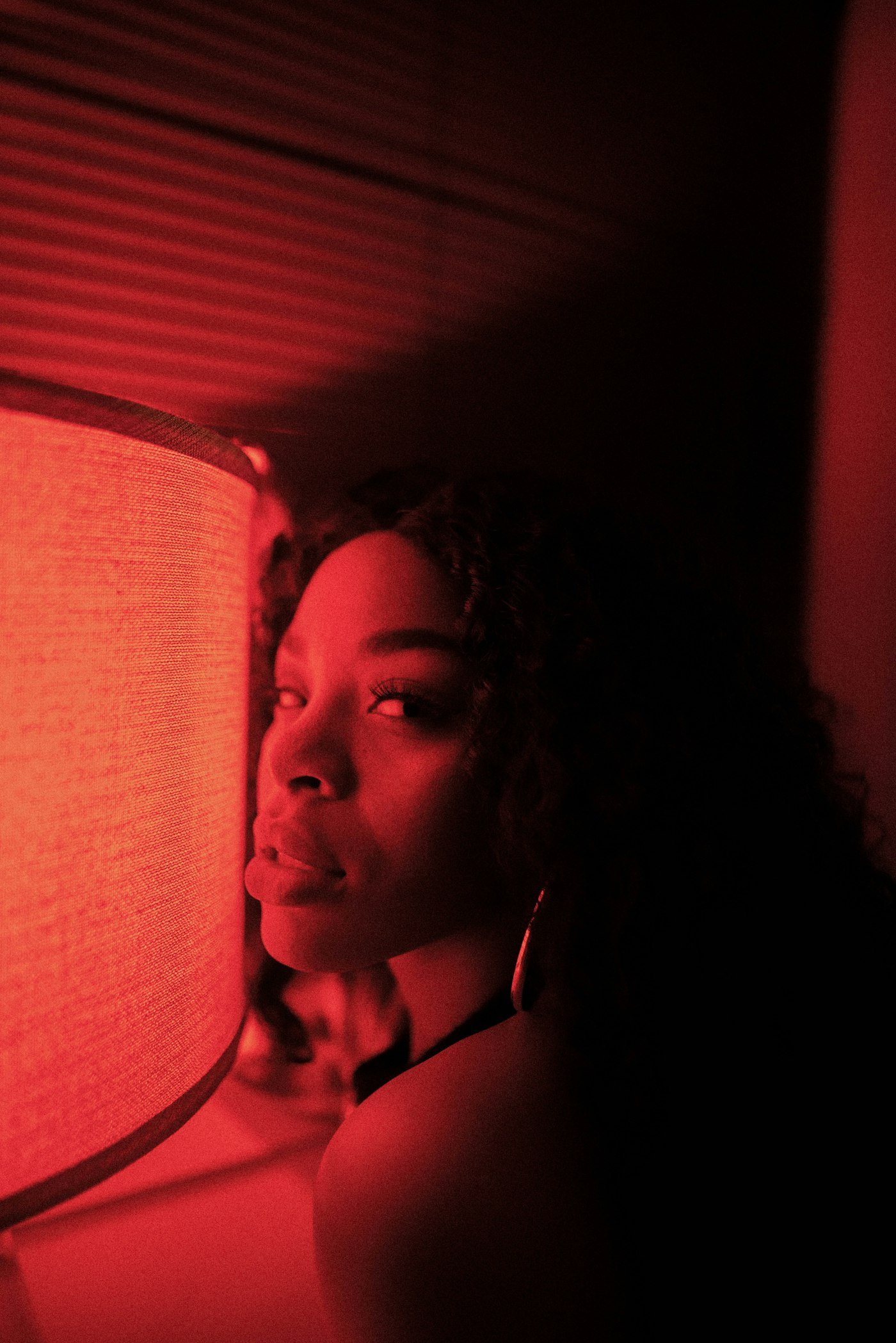 Woman resting in soft red light